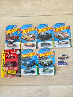 6 Hot Wheels Cars, Vintage Toys R Us Fast Lane 2 Pack Diecast cars, 2 Car Stickers, and 5 Plastic Clam Protectors