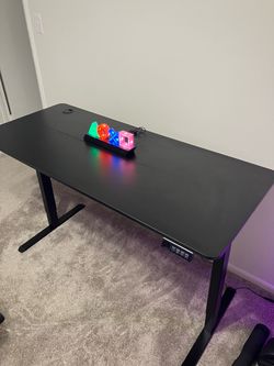 Adjustable desk and massage gaming chair