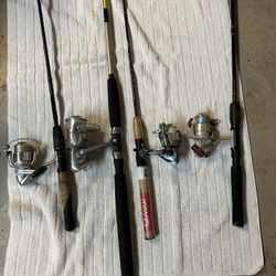 Four Fishing Poles And A Bunch Of New Tackle