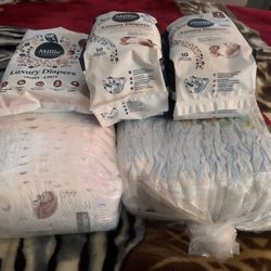 Diapers Size 1 And NB Kirkland Millie Moon And Regular Diapers 