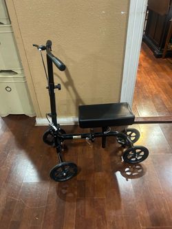 4 wheel black scooter. Brakes work great. Clean