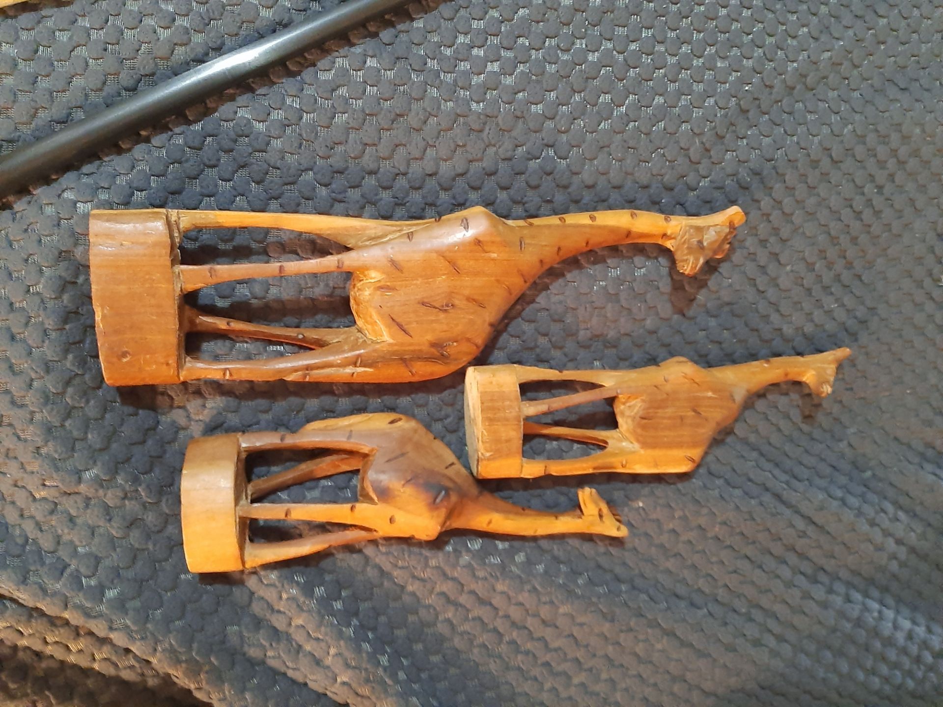 Three hand carved Giraffe