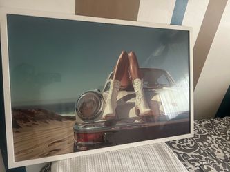 Large photo in white frame, looks like 3x4ft