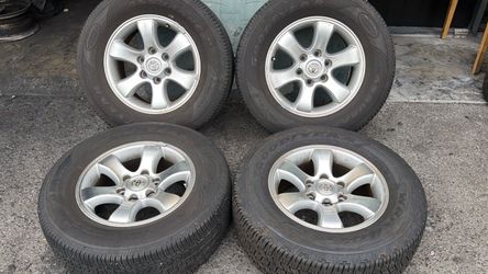 Toyota 17 Inch stock Aluminum rims and caps with old tires 6 Lug truck or SUV