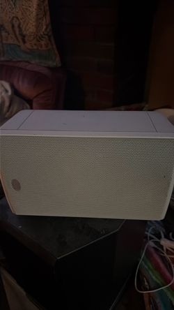 Klipsch outdoor speakers with mounting bracket.