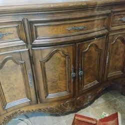 this furniture piece is a vintage sideboard or credenza in the French Provincial style