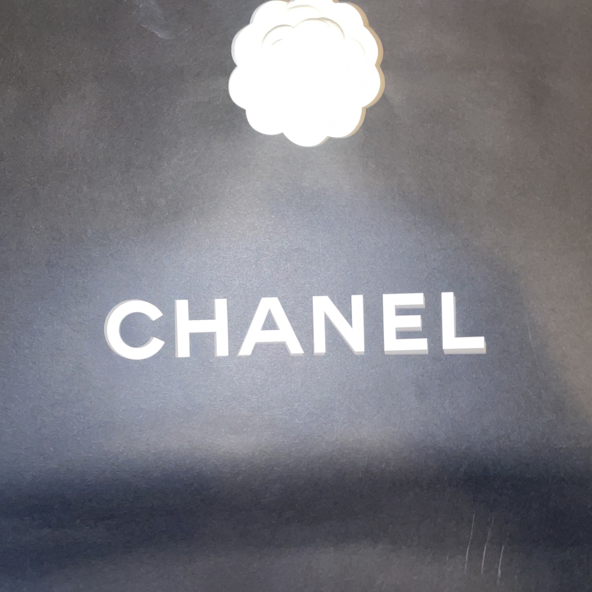 chanel paper bag has rip