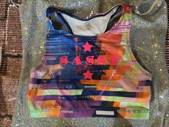 Girls tie-dye sports bra with “sassy” in hot pink