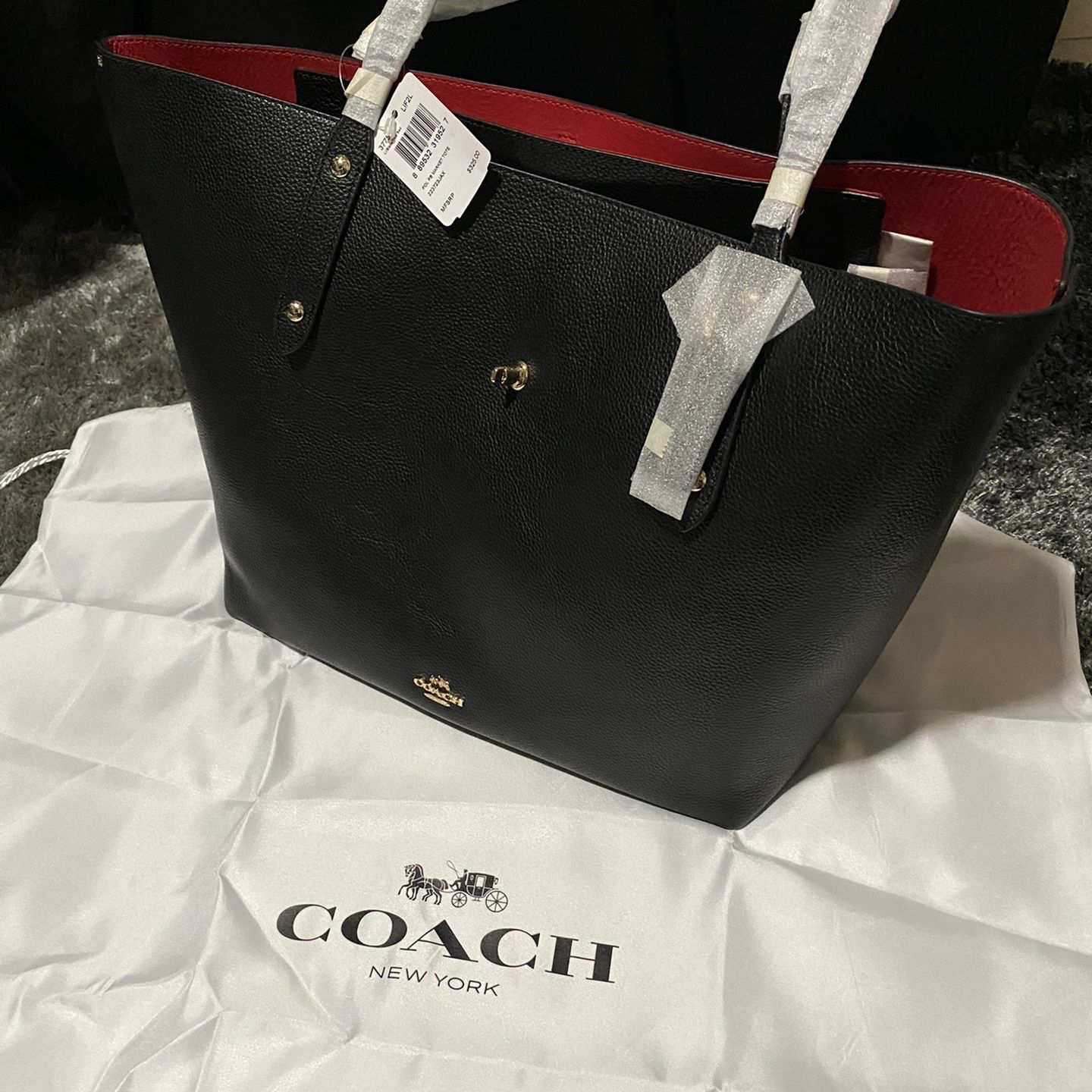 Coach black tote with hotsell red interior