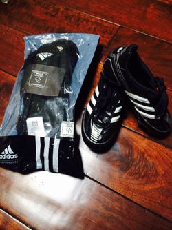 Kids soccer shoes and shin guard