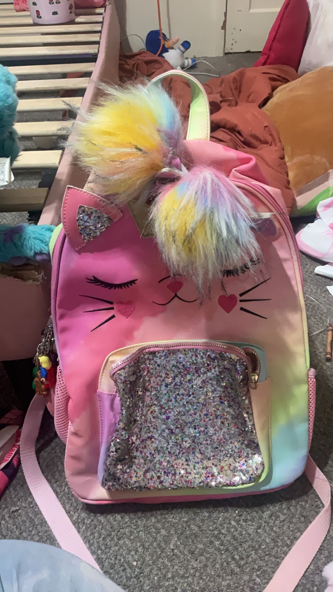 Unicorn kitty backpack with a a lot of keychains