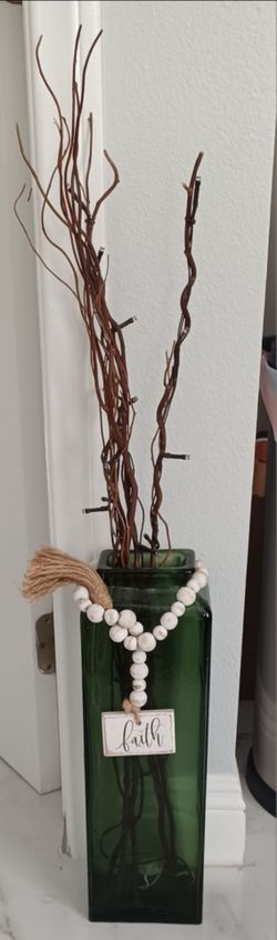 Green Glass Vase with Decorative Branches and Bead Garland
