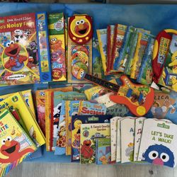 Various Sesame Street Books And Dolls