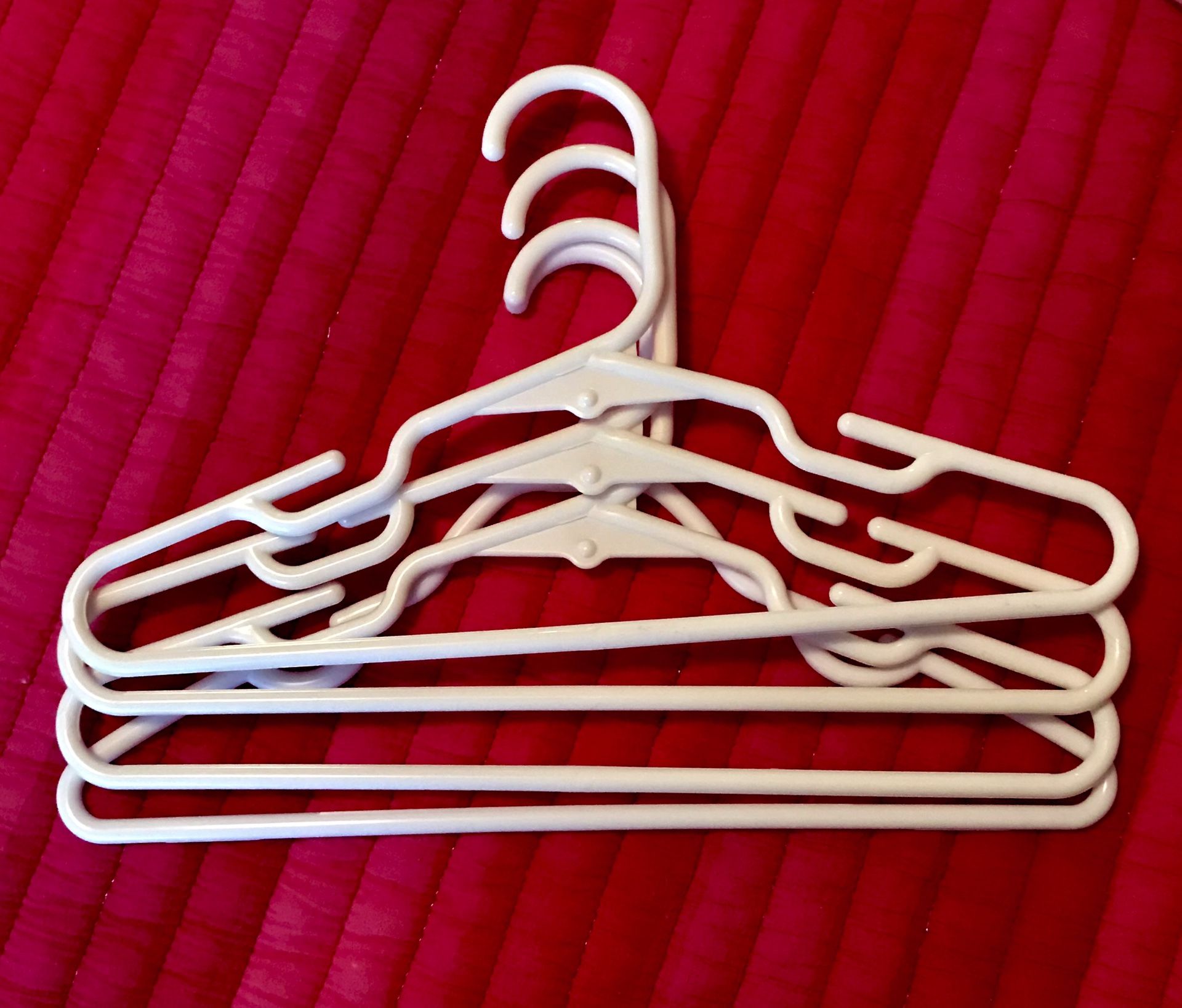 Plastic baby/kid clothes hangers.