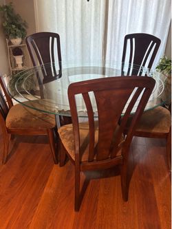 Round glass table with six chairs, solid wood