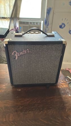 Electric base guitar (with the speaker, power cord, and stand)