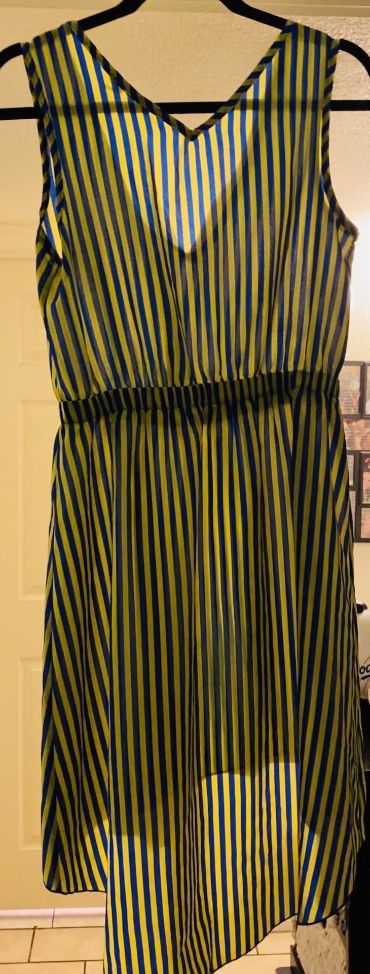 Preowned woman’s size M yellow/blue dress in great condition but a bit see through located off lake mead and jones area asking $3