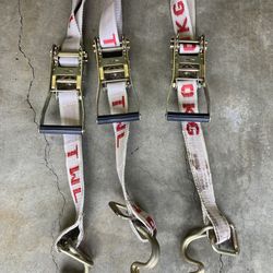 Ratcheting tie down straps.  Heavy duty, 30 feet long.  Like new.  3 each