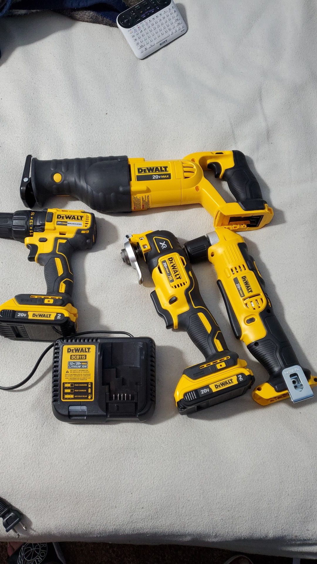 Dewalt 4 Tool Set with Batteries and Charger. Drill Driver, right angle drill, oscillating tool, and sawsall. All new unused
