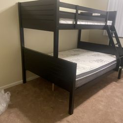 Free delivery. Twin/full $350 for bunk bed only. $550 with mattresses. Available in espresso and white  Assembly required. Assembly not included. Cash
