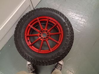 Falken Rubitrek A/T Tire on Red Alloy Wheel