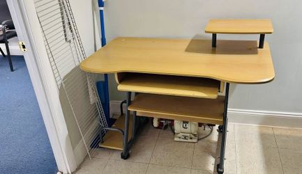 Multilevel Computer desk with surfaces for keyboard, screen, speakers, tower etc. 