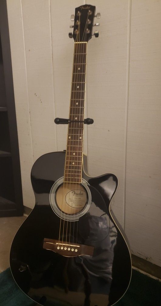 Fender acoustic/electric guitar and amp.