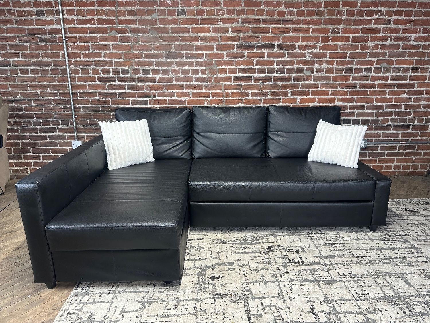 Delivery Available IKEA black leather sectional sofa couch