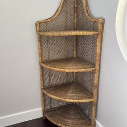 Tall corner wicker Rattan shelving unit.