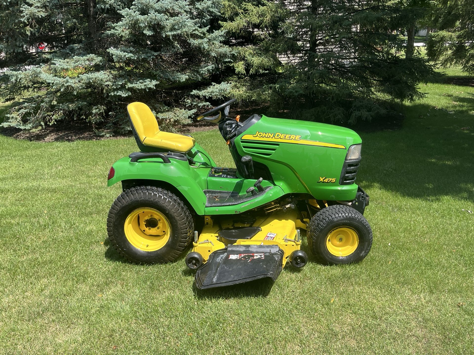 John Deere X475 Garden Tractor Riding Lawn Mower With a 62 Inch Deck And A Liquid Cooled Kawasaki Motor