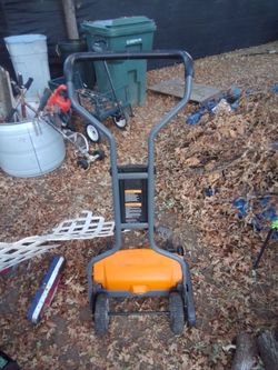 Fiskars manual push grass cutter.