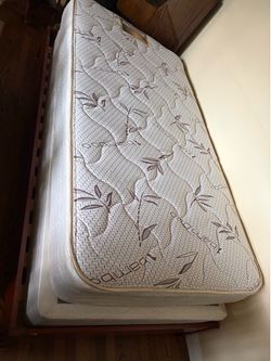 Wood twin mattress frame and mattress set.