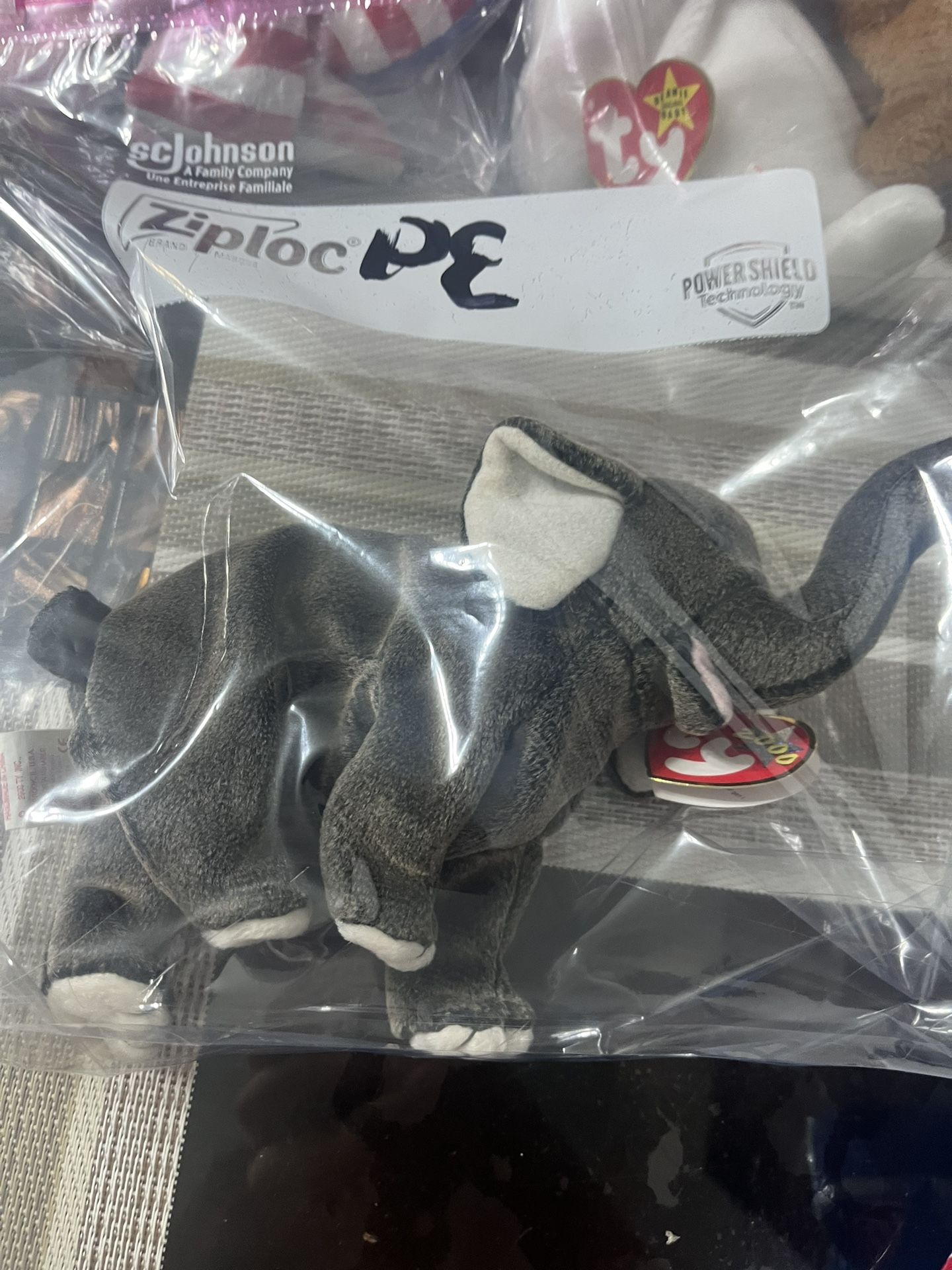 2000 elephant beanie baby with printing error, has silver mark