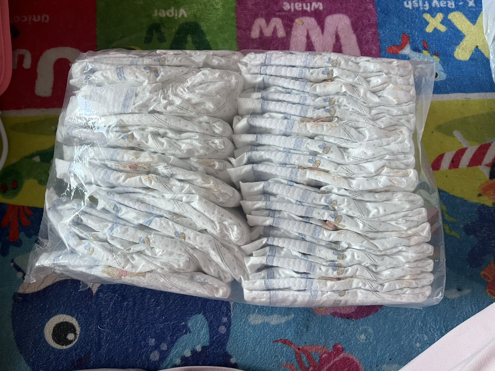 100 Newborn Pampers swaddlers & 30 Newborn Huggies