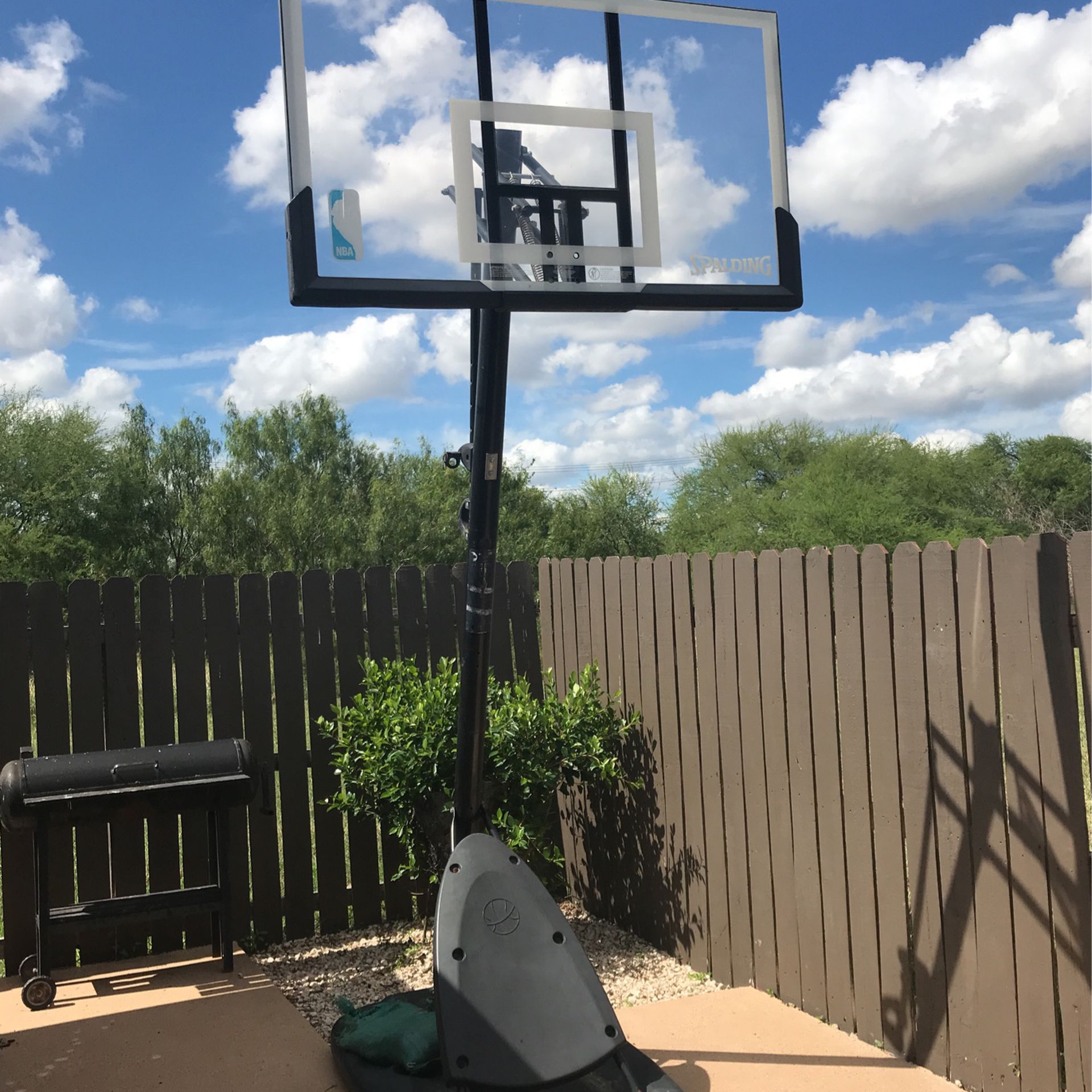 Basketball Court/missing ring/one broken leg rusty
