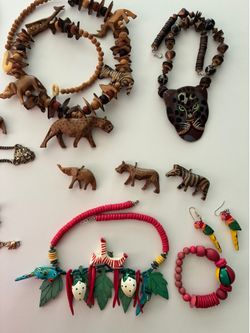 Jewelry: necklaces, bracelets, earrings. Wooden and metal animal shapes.