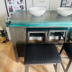 Gray kitchen island table with four stools For Sale