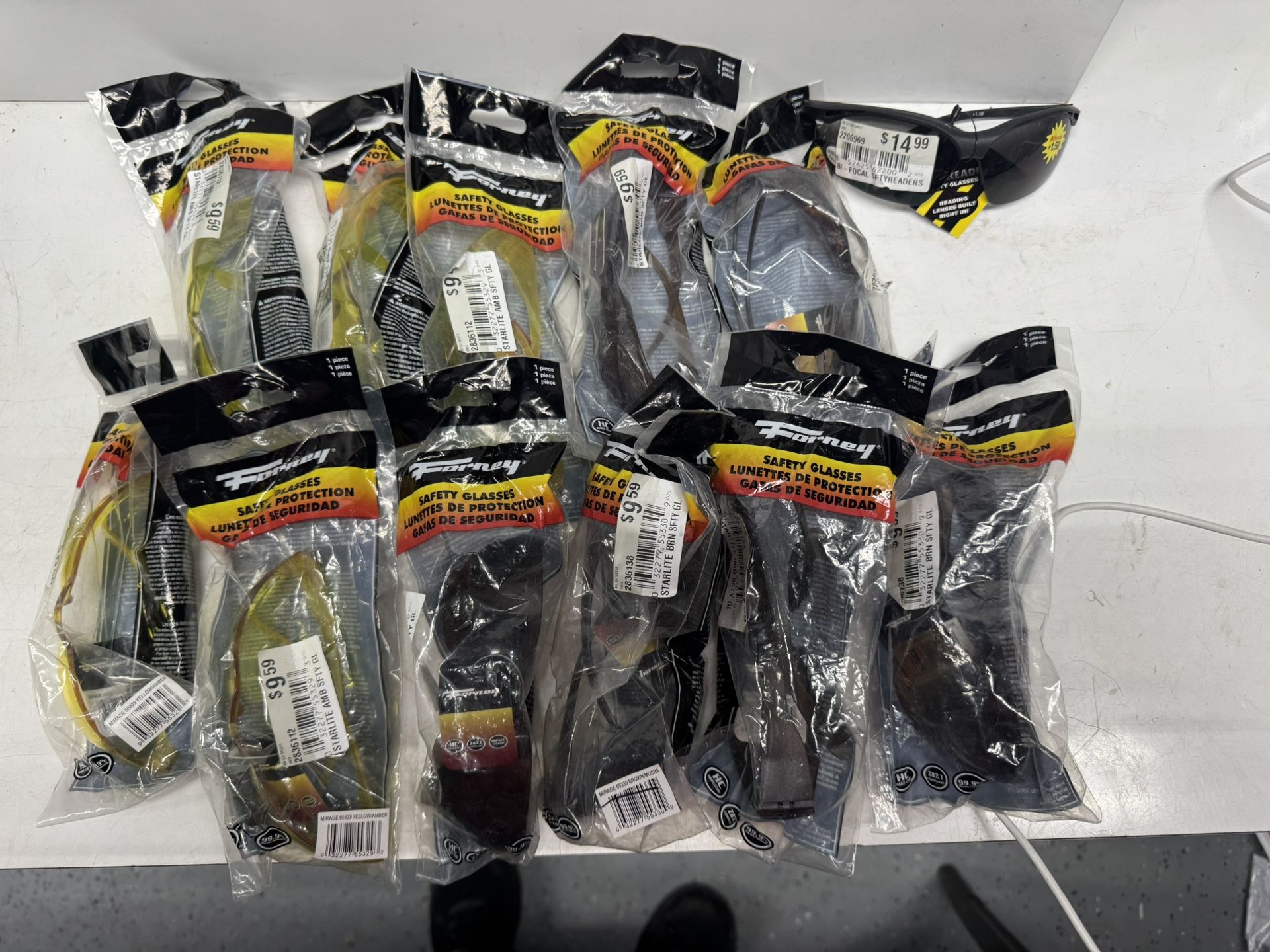 12 Pair Of Safety Glasses. $10 Takes All. Must Pick Up