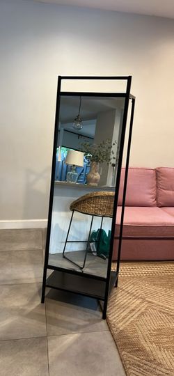 Standing mirror with clothes bar
