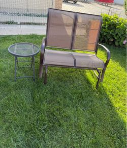 LOVESEAT METAL GLIDER IN EXCELLENT CONDITION WITH A ROUND SIDE TABLE. SMOOTH AND QUIET . $130.00 OR BEST OFFER.