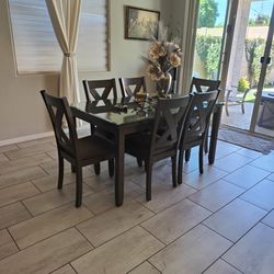 36"×60" Beautiful Gray Finish Dining Table And 6 Chairs With Glass Top Matching With 3 High Bar Chairs For island .Purchase From Ashley Furniture