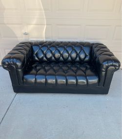 Leather Chesterfield Styyle featuring Deep Button Tufting and Rolled Arms