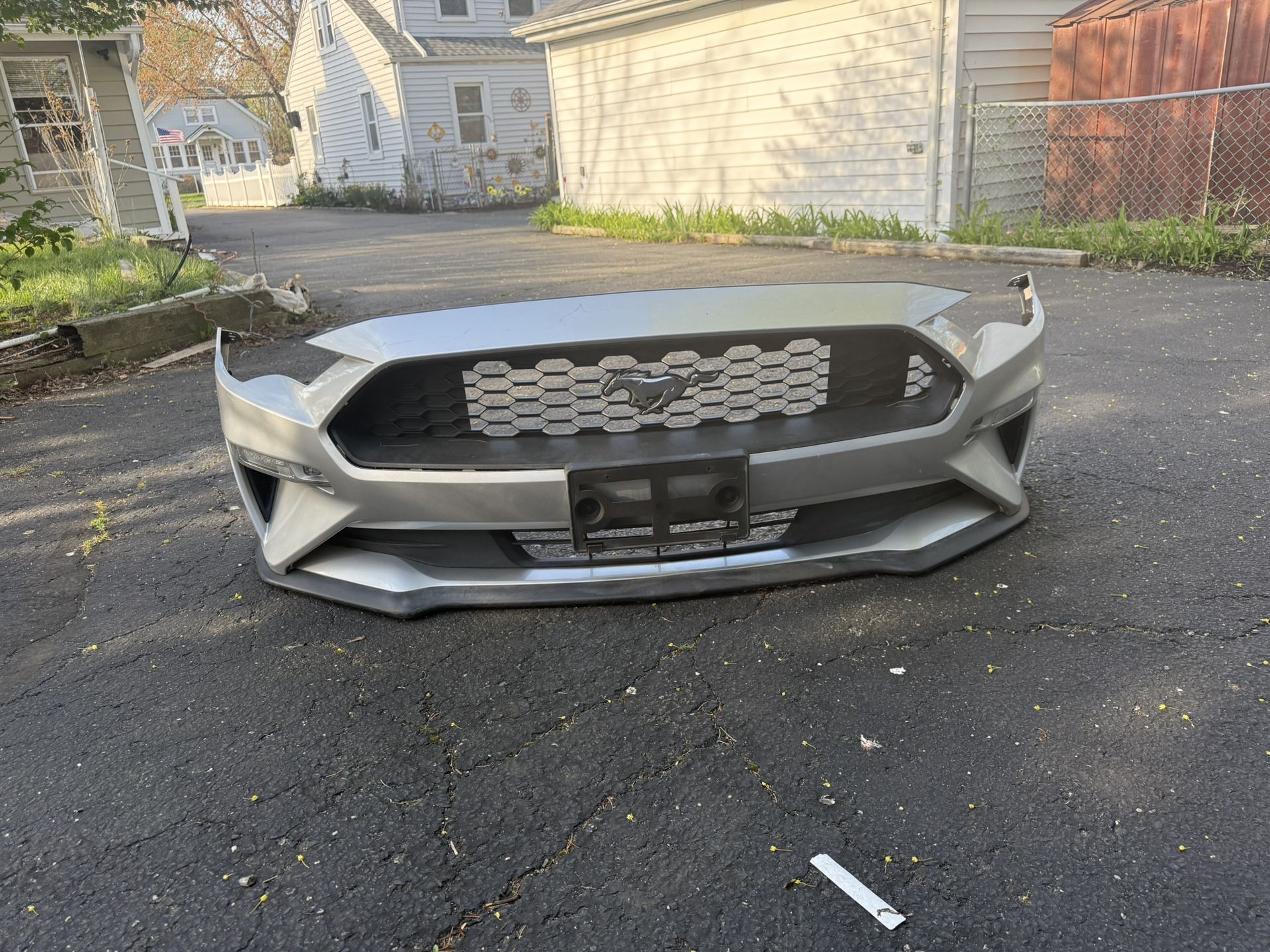 I'm selling the front bumper of a Ford Mustang with its original tracks and the bumper is original in perfect negotiable condition for a 2019 Ford Mus