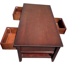 Coffee table with 3 drawers that open to both sides.  45 3/4 W x 23 1/4 D x 18 1/2 H 