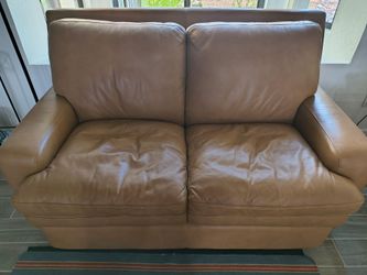 Gently Used Bassett Upholstery Leather Loveseat. Has a few scuff marks from moving across country