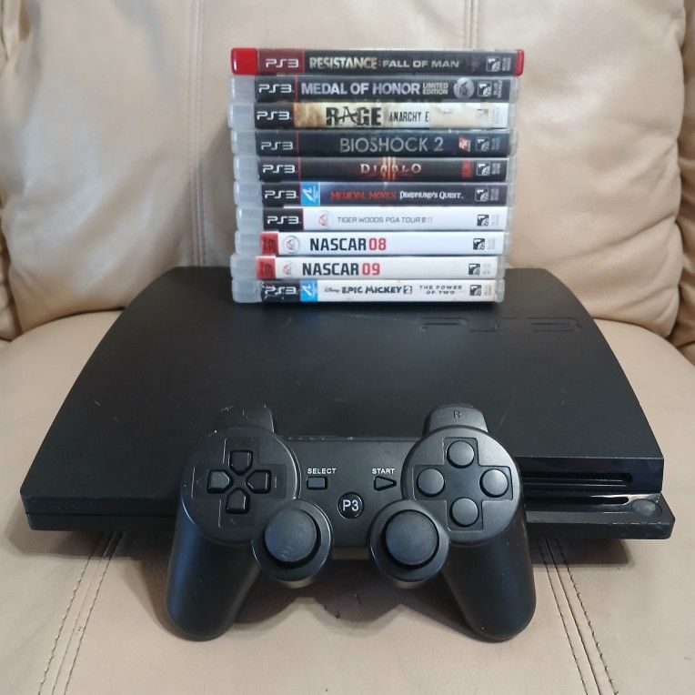 Playstation 3 with cables and contoller plus 10 games read description