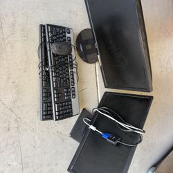 Two Computer Monitors And Keyboards 