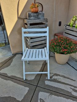 Shabby chic!!!  Perfectly distressed white fold up wooden chair