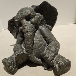 Bronze elephant calf sculpture was made By Richard L. Lewis