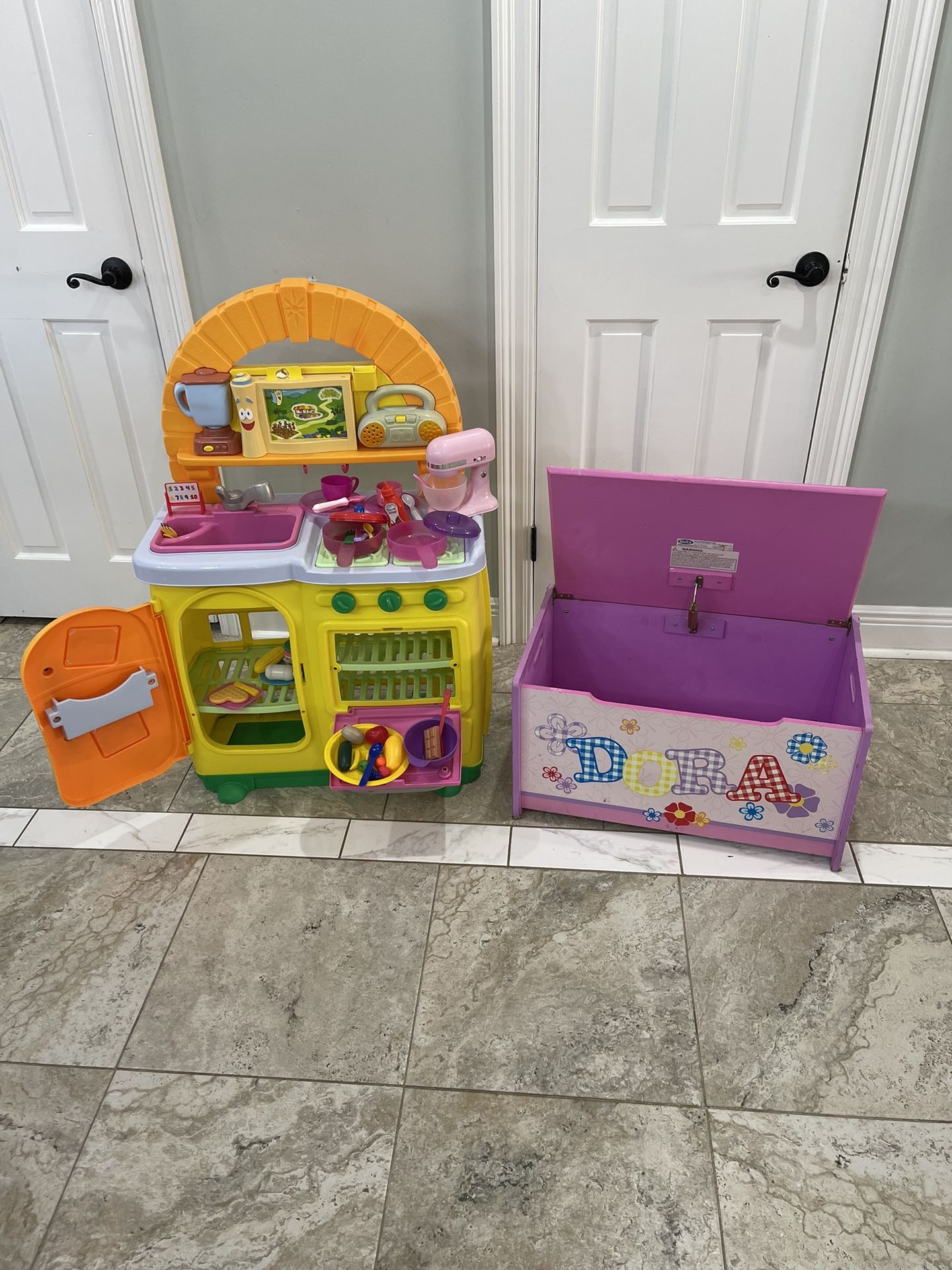 Dora Kitchen play and toy chest everything that is in the picture is include.. The kitchen has sounds 